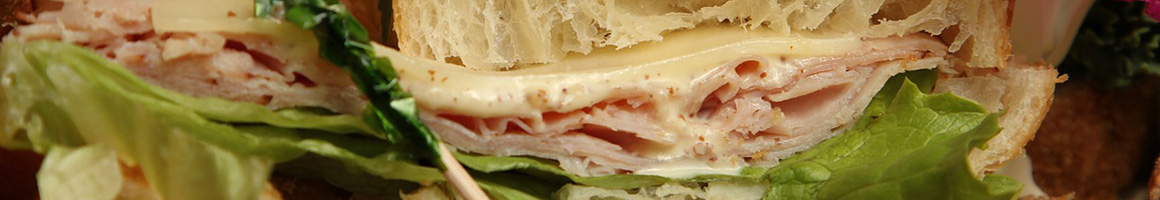 Eating Deli Sandwich at New York City Deli restaurant in Los Angeles, CA.